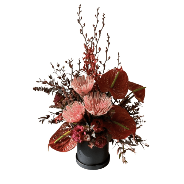 Black floral box 9
Red anthurium, Protea and James story orchids&quot;
