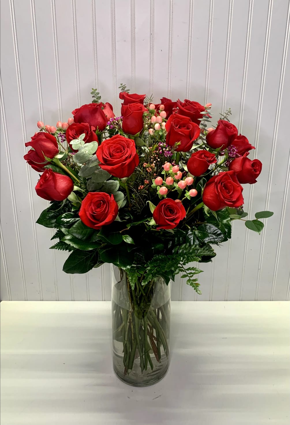 A beautiful arrangement with red freedom roses, perfec for that special person