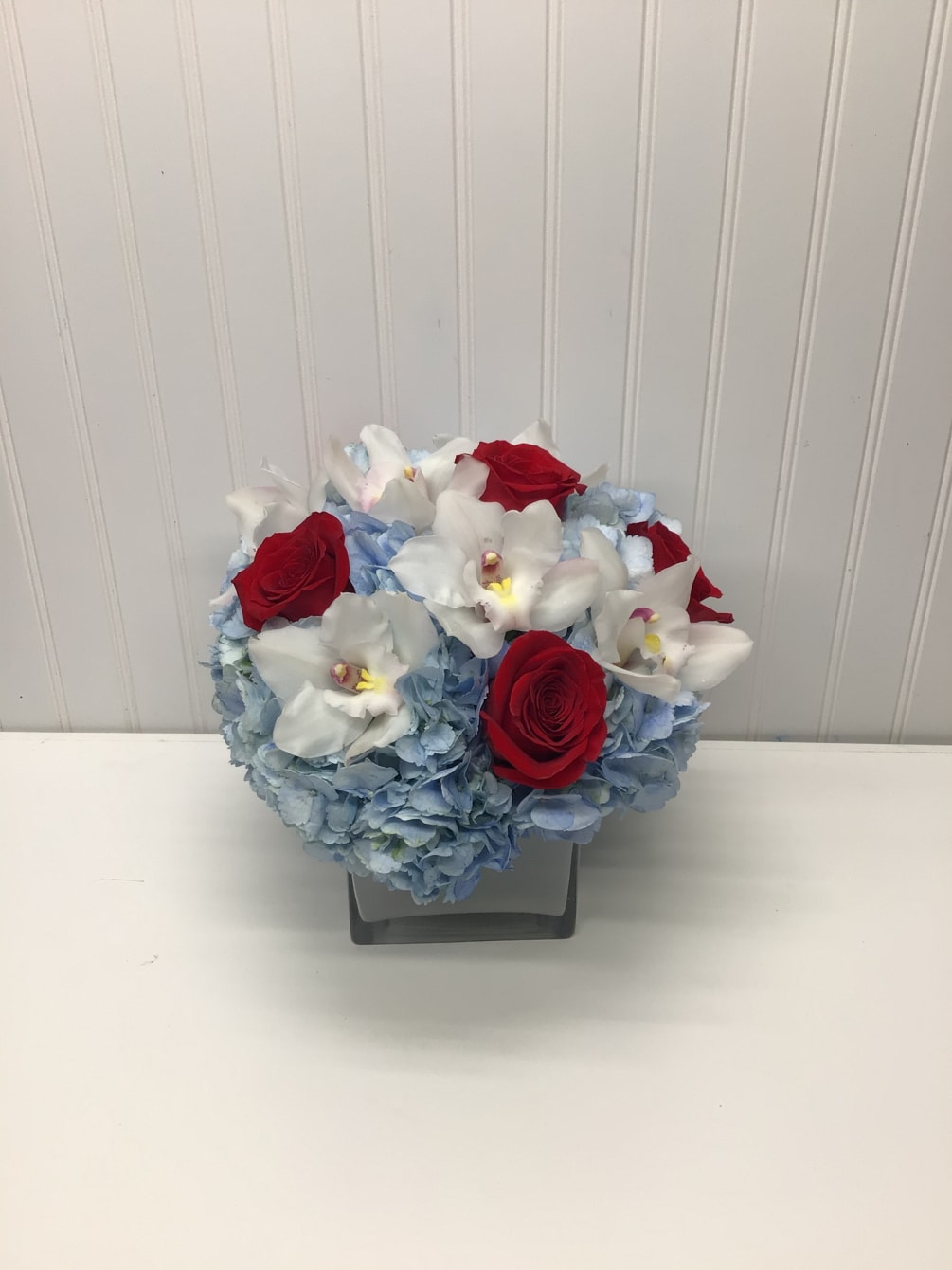 Lovely reds and blues with white come together in this romantic gift