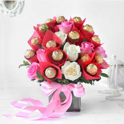 A precious mix of flowers in a vase with Ferrero Chocolate sharing