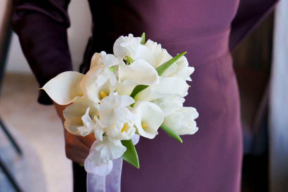 Hand tie bridal bouquet with tulips, calla lilies, Japanese sweet pea