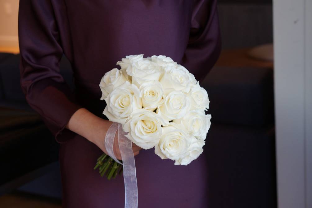 Hand tie bridal bouquet with white roses