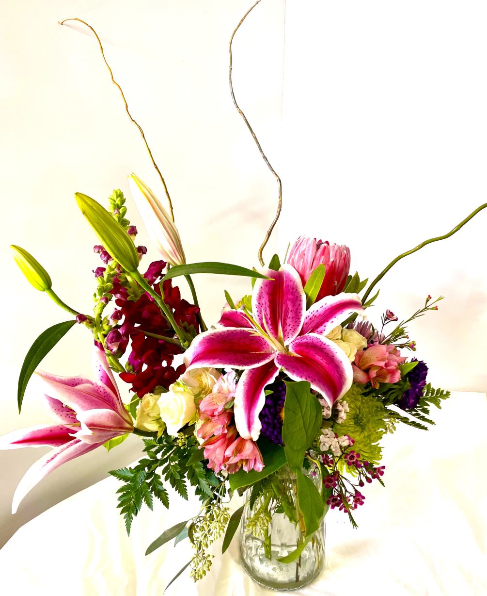 Absolutely stunning arrangement that will truly brighten anyone&#039;s day. Stargazer lilies, protea