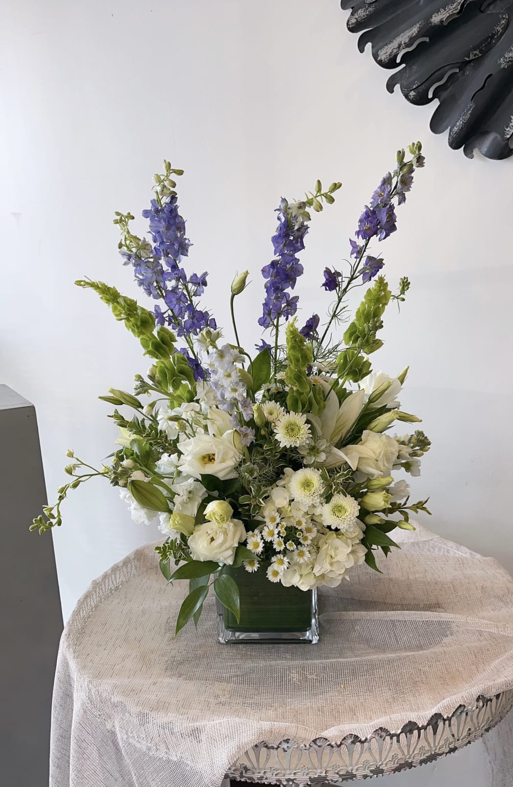 A lovely touch of lavender and white in a cube vase