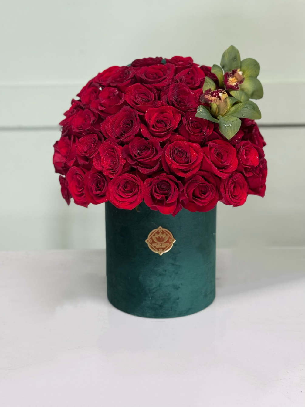 Red roses with Orchids in a velvet box . 
Standard 50 red