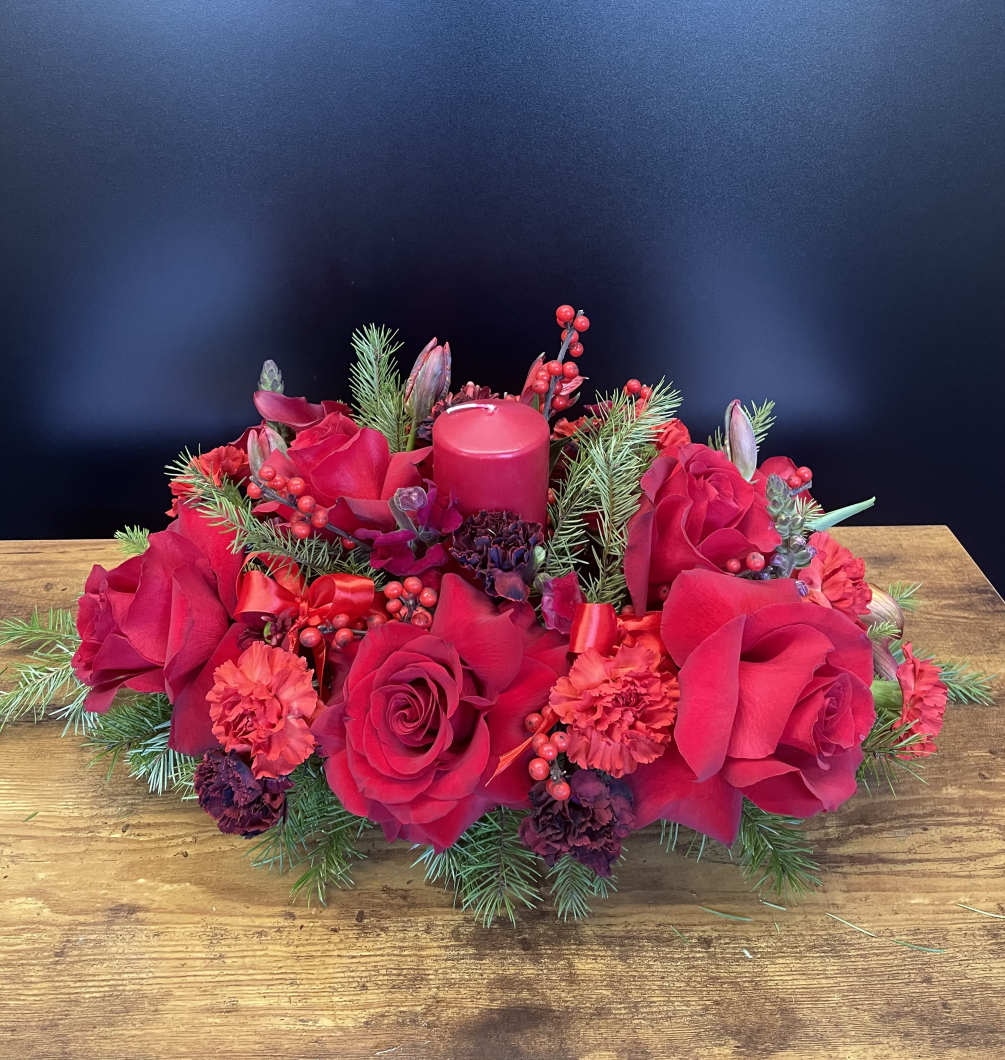Red pallet flowers with red candle centerpiece.