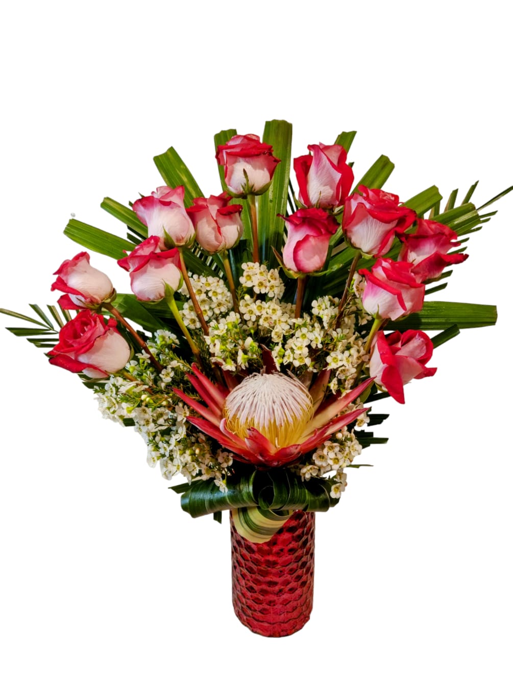 A dozen two-toned roses and wax flowers surround an exotic Red King