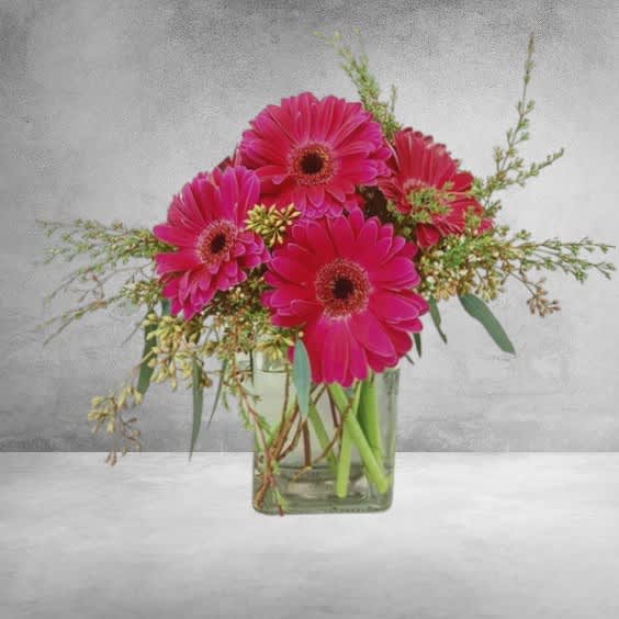 Introducing the exquisite Gerbera Daisy Bouquet, a captivating floral arrangement meticulously crafted