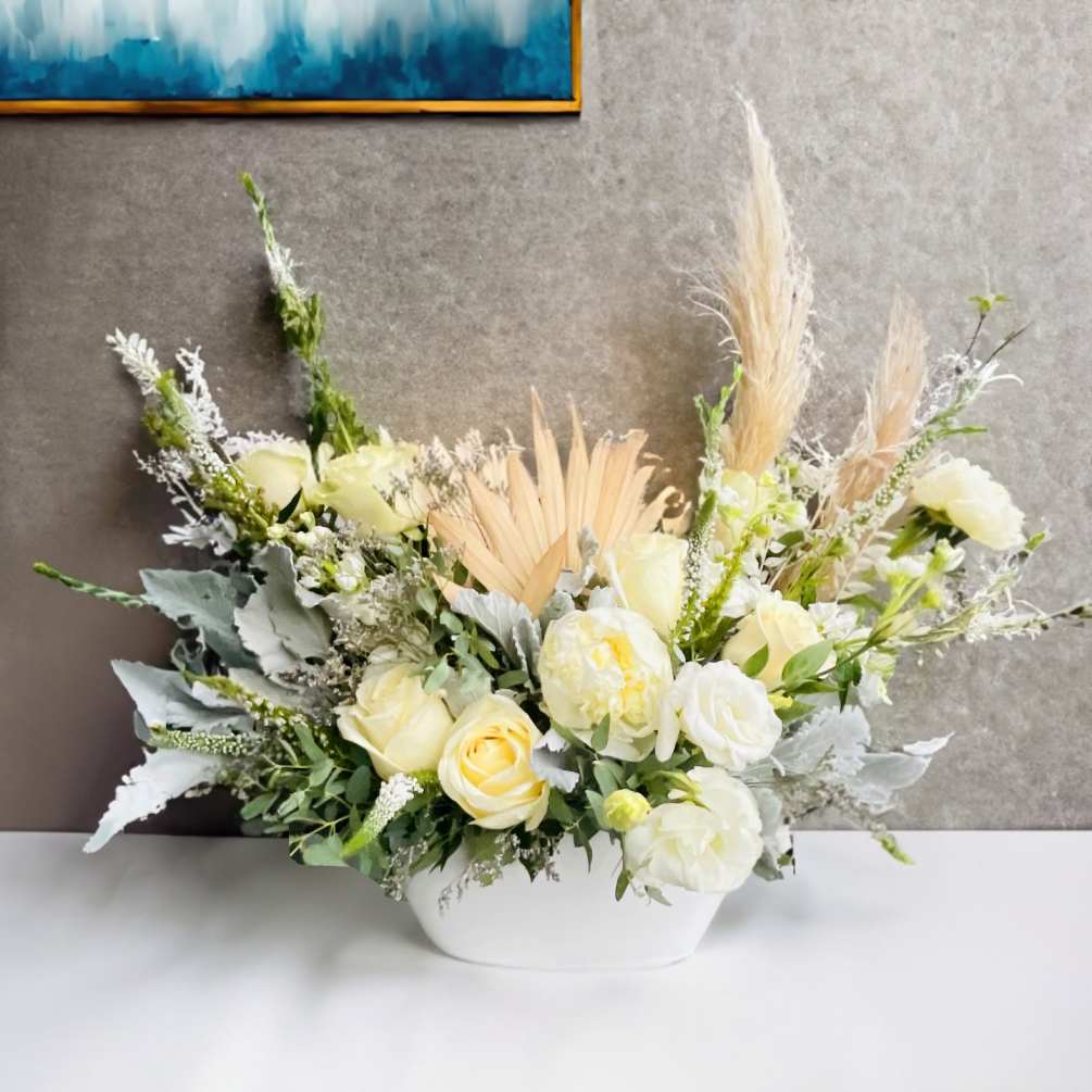 Whites and creams mixed with pampas grass and dried elements soft yet