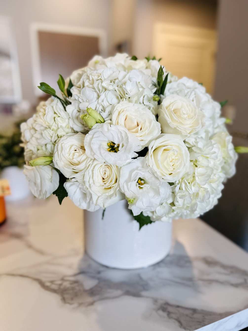 Purest of whites with hydrangea roses and soft lisianthus ins. Clean contemporary