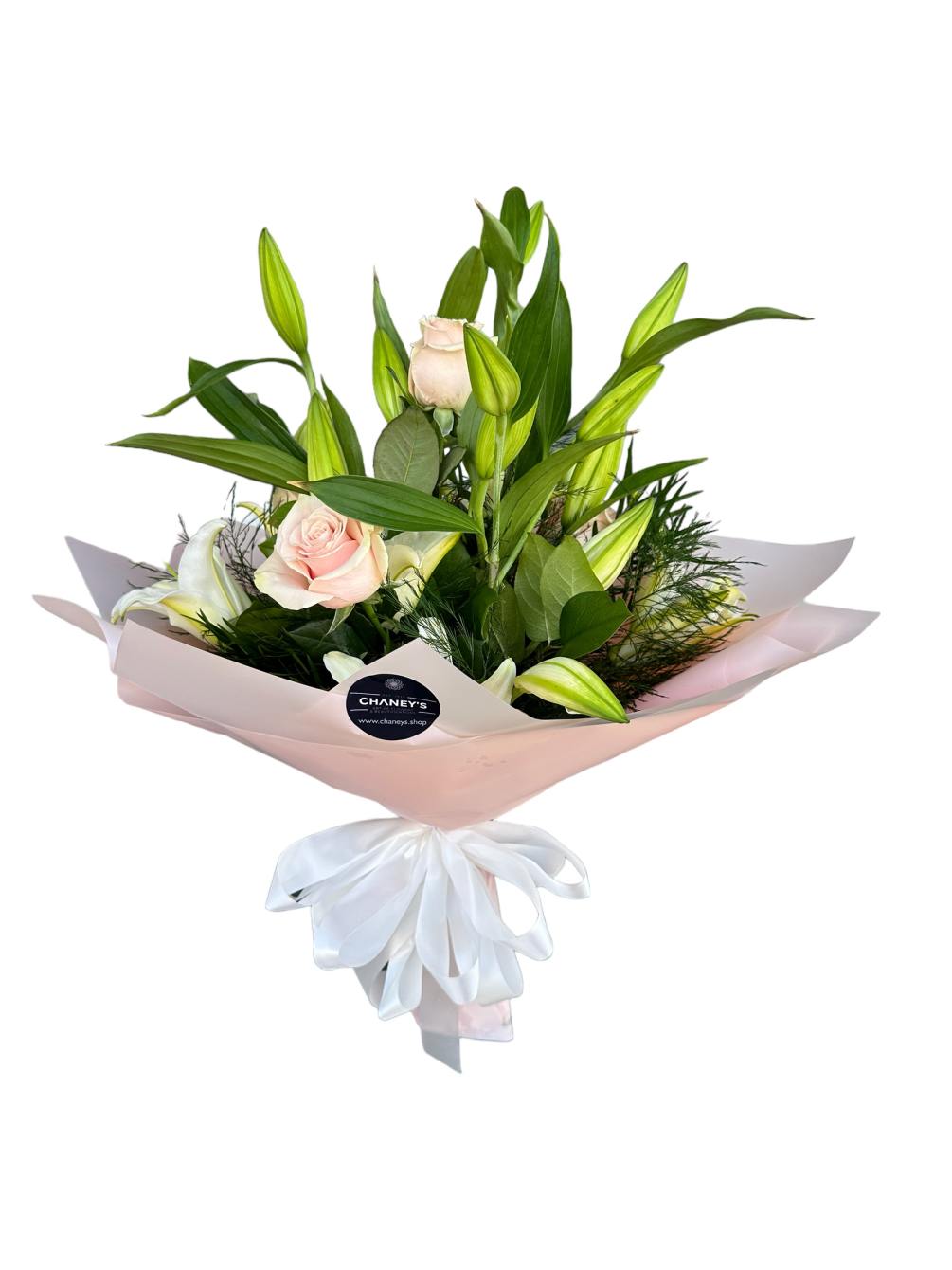 A sweet and tender flower arrangement all held in ros&eacute; &amp; light