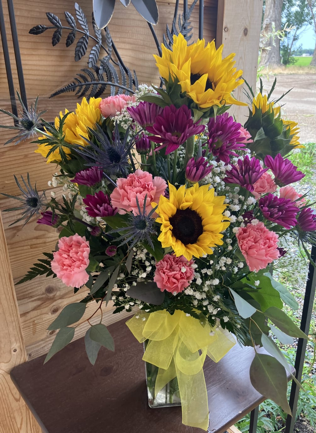 This bouquet with sunflower will brighten up any room! It can be