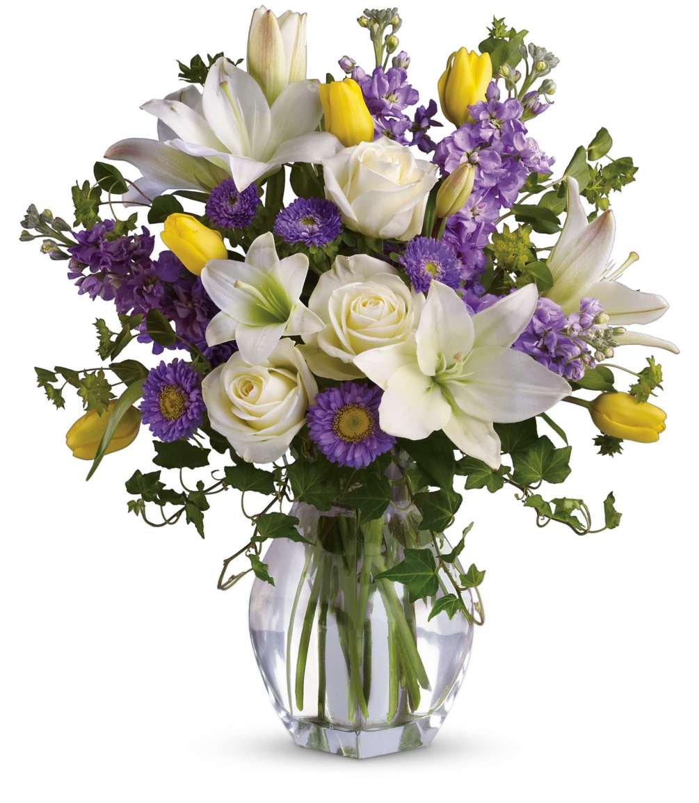 Graceful, elegant and timeless, this beautiful spring bouquet offers up colors, blossoms