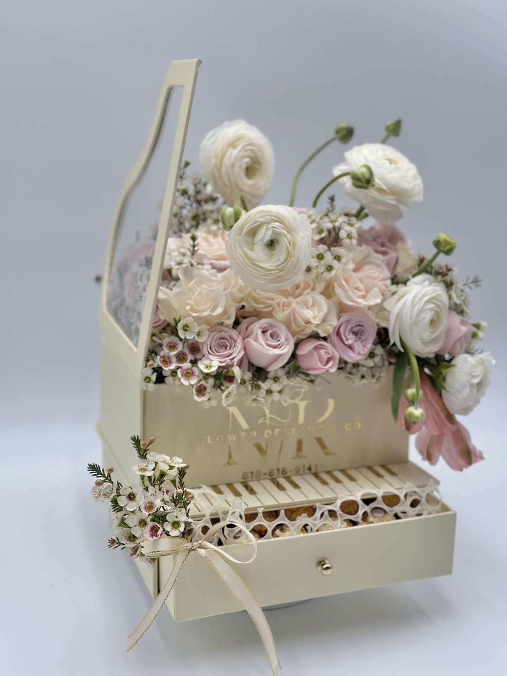 Ranunculus and Rose delicate combination for Spring! This piano box arrangement comes