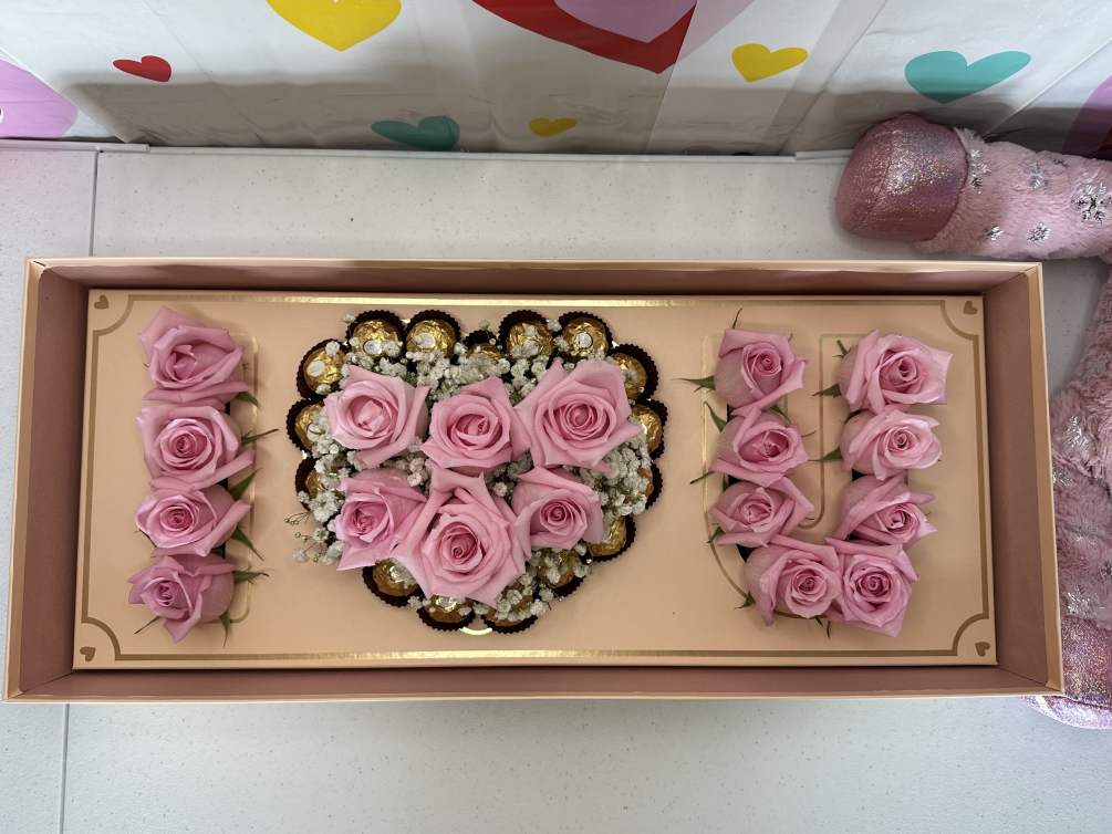Standard: Roses with baby breath and chocolates
&quot;Picture is a reference every arrangement