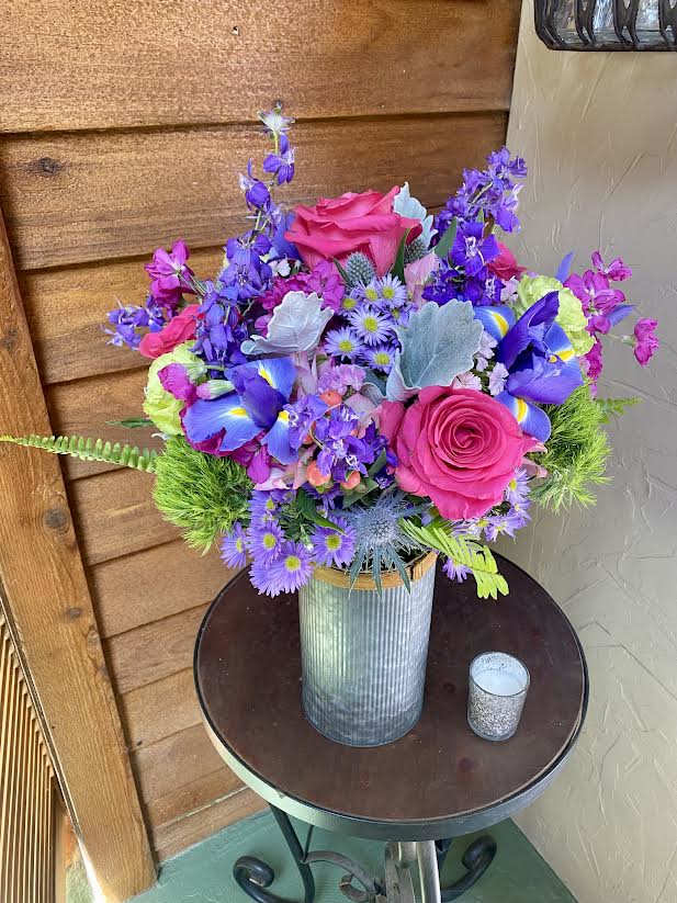 Lovely designer mixed flower bouquet in a designer selected vase.  Always