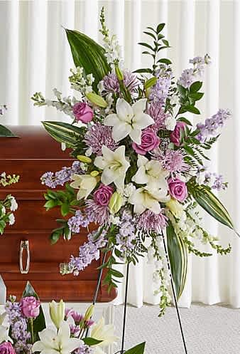 Featuring heartwarming lavenders and whites, the traditional arrangements .Standing Spray shares the