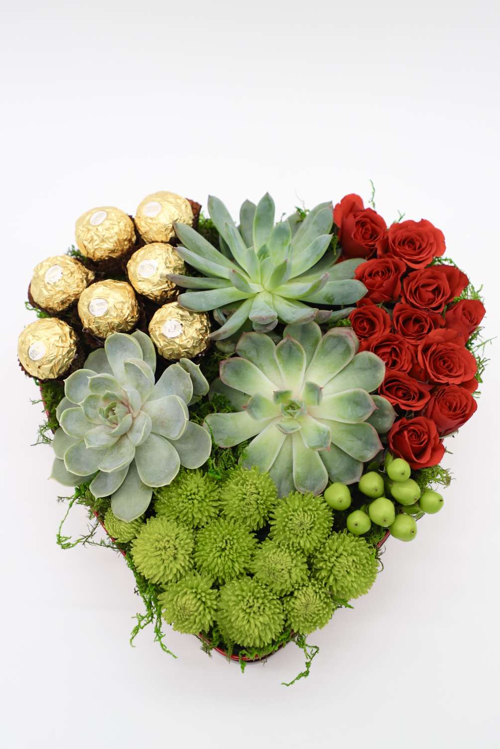 This heart shaped tin box is stuffed with gorgeous succulents, spray roses