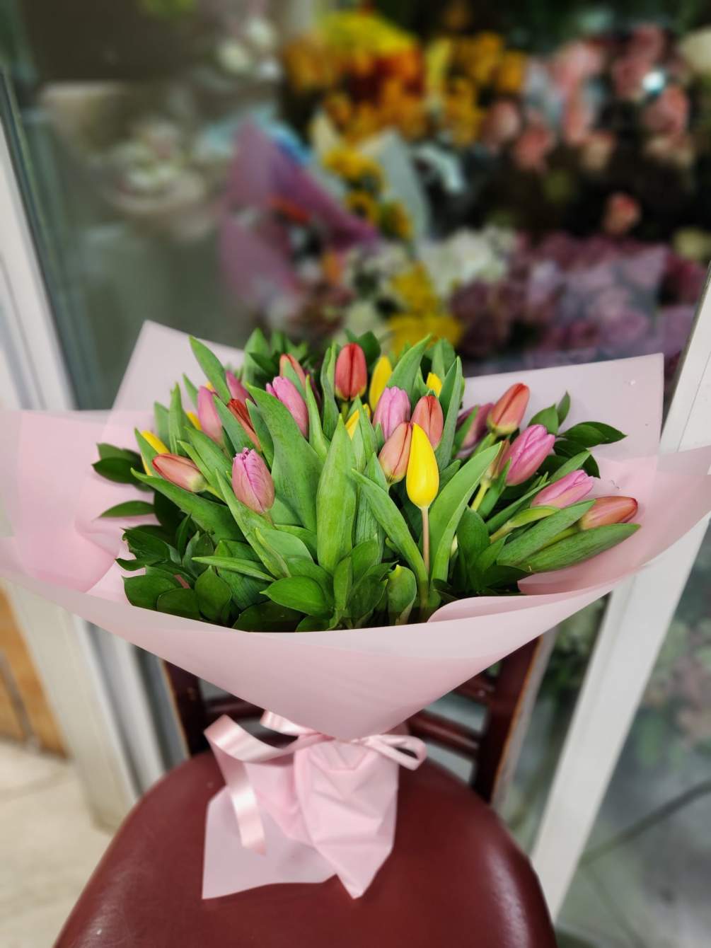 Fresh cut tulips arranged in hand wrapped bouquets.  Please call for