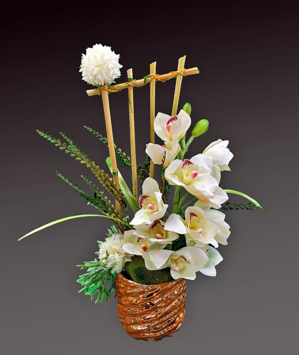 Minimalist beauty abounds in this unique mix of orchids, gladioli and leucadendron.
