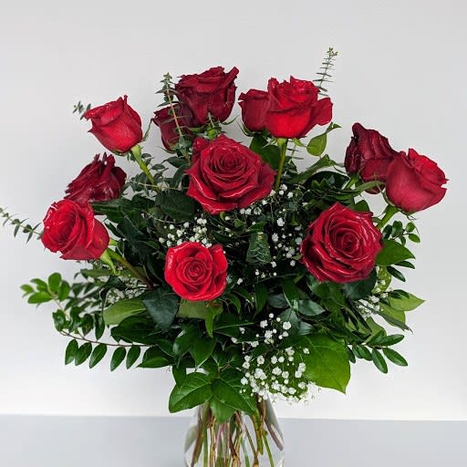 A beautiful arrangement of a dozen long-stemmed roses in your choice of