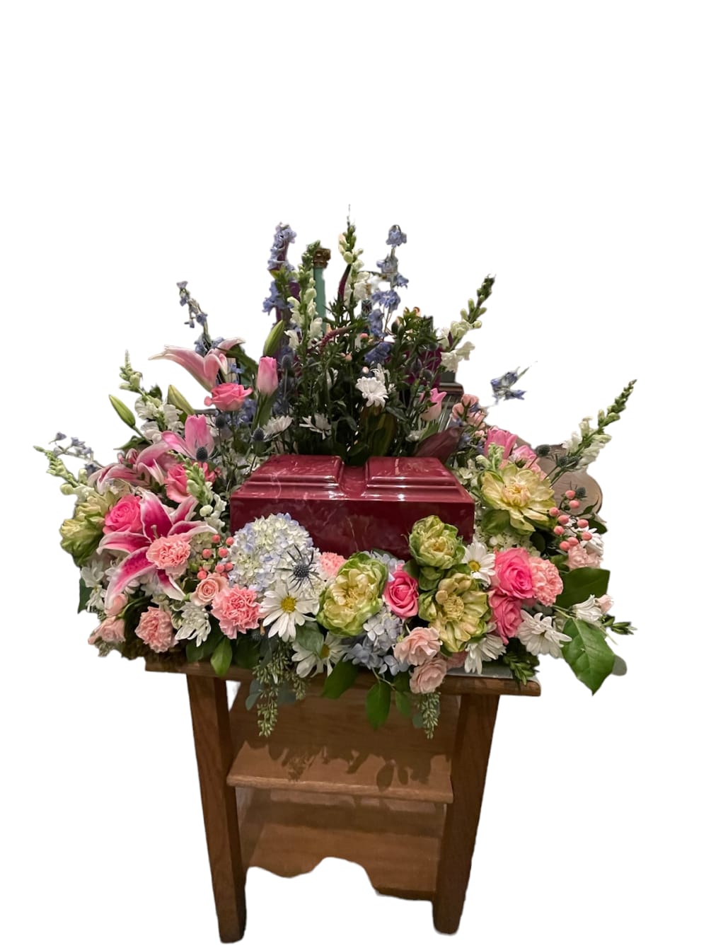A mix of pastel flowers in an Urn surround