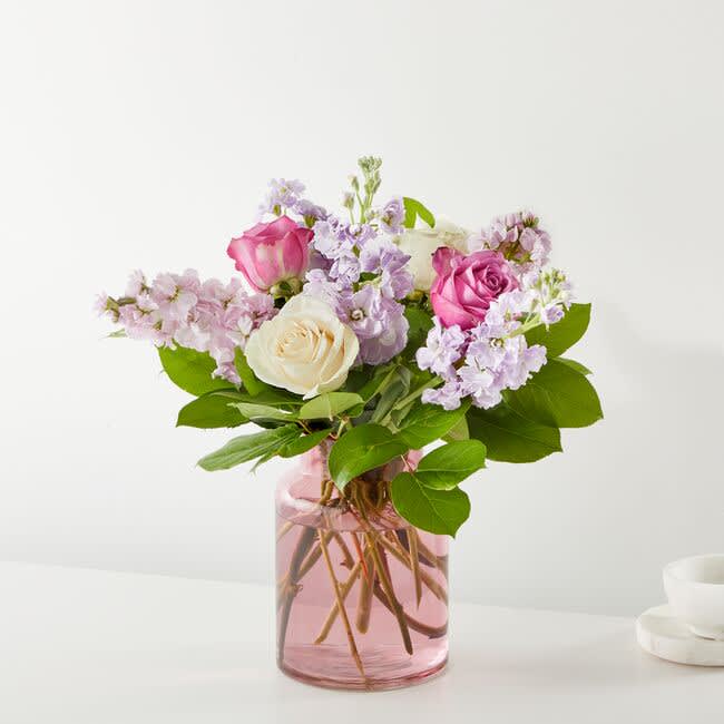 Celebrate Spring with roses and stock in soft shades of pink, lavender