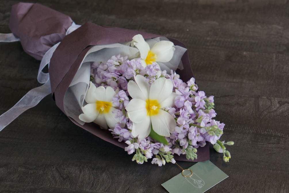 A bouquet of lavender stocks and white tulips