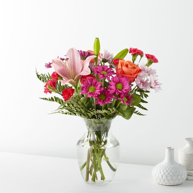 The Light of My Life Bouquet features bold blooms in purple, pink