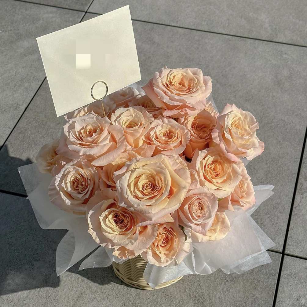 Approximately two dozens of roses in peach 