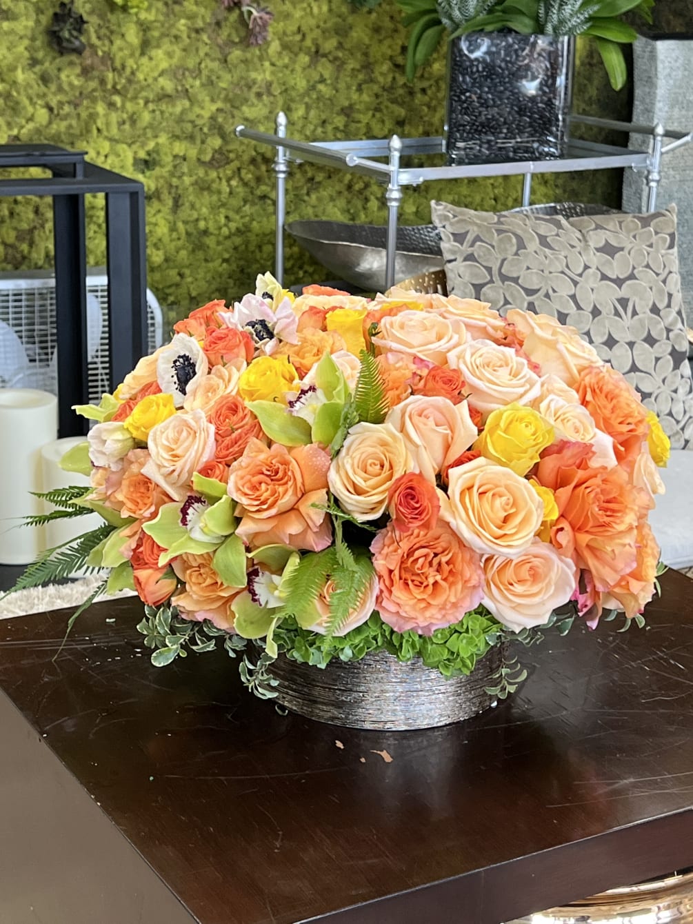 This beautiful holiday themed arrangements orange And yellow roses 
