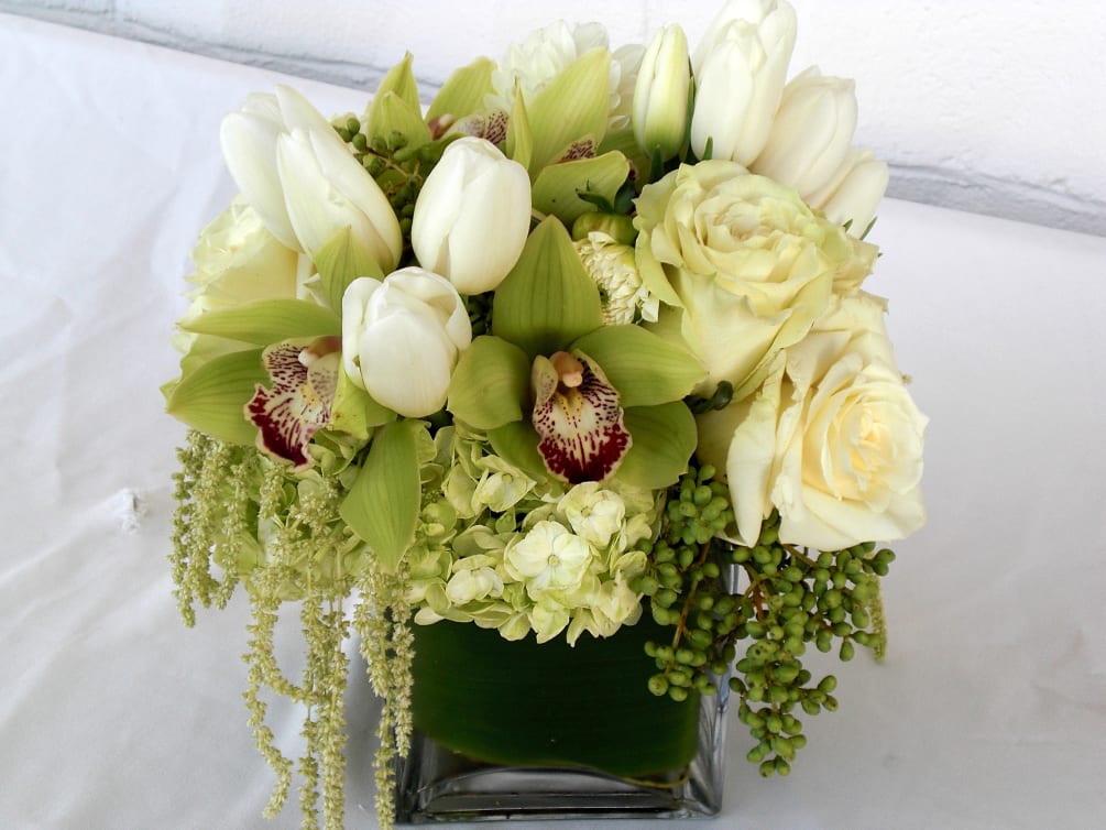 Simple and elegant combination of whites and greens, in roses, tulips, hydrangea