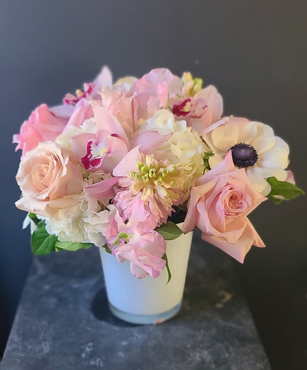 A sweet bouquet of soft pink and white blooms in a modern
