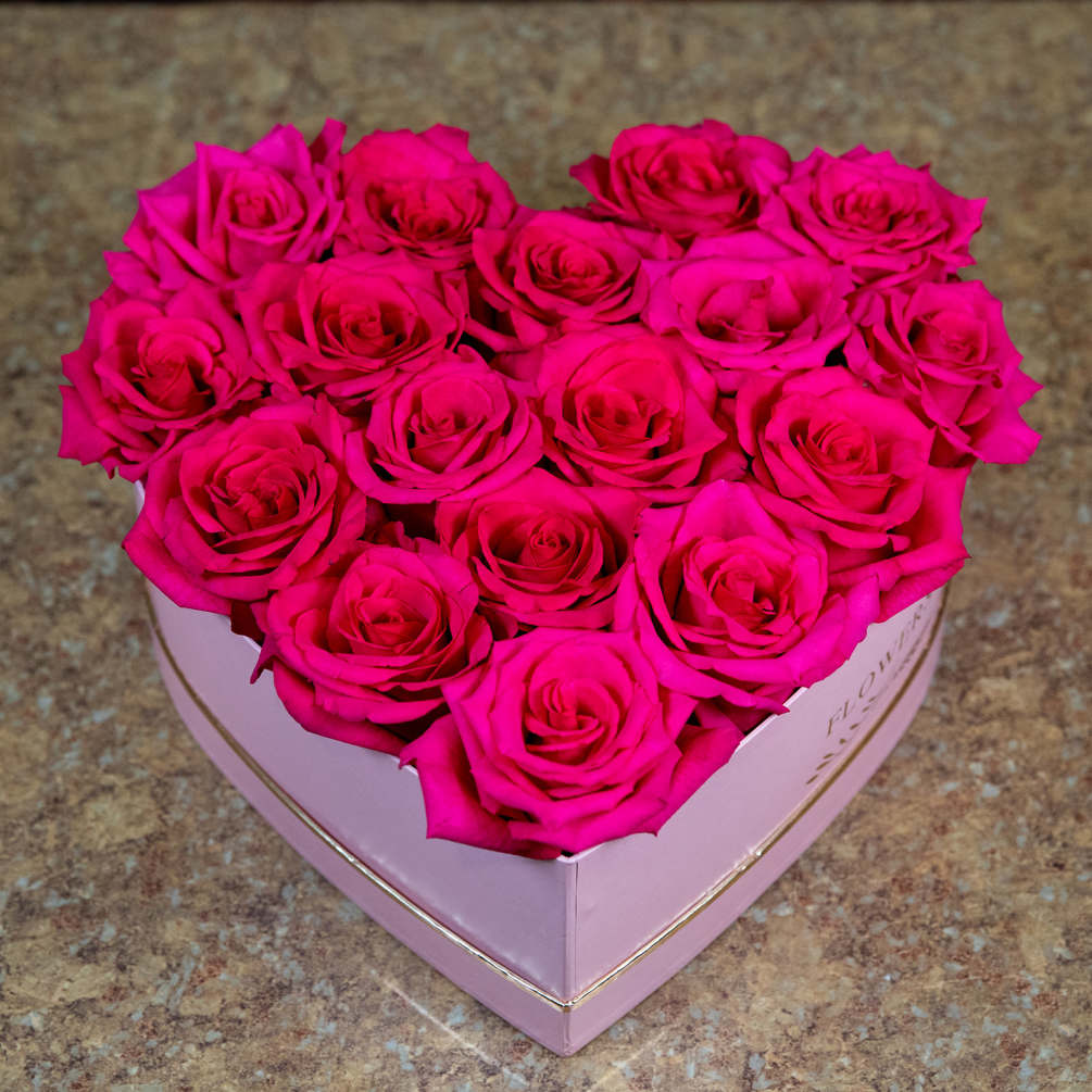 Our Heart box features hot pink roses in a pink heart box!