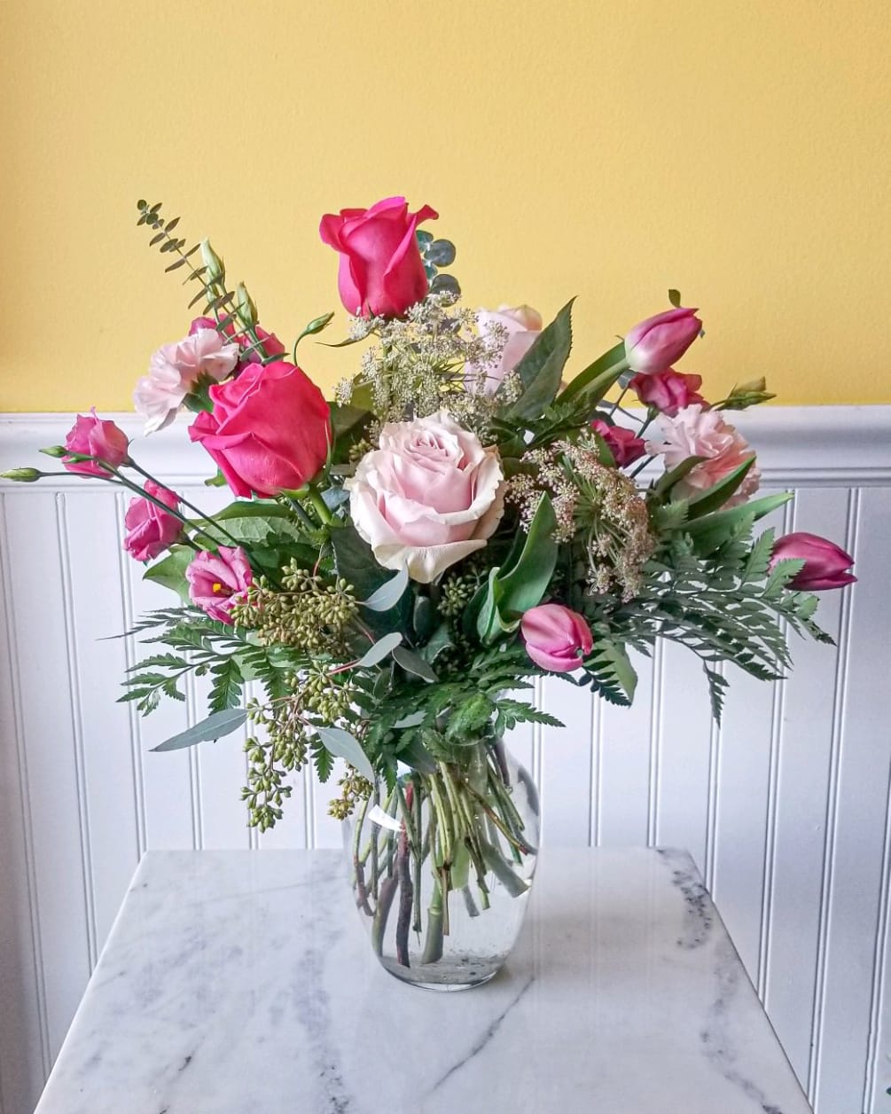 A Designers Choice of various shades of Pink flowers. Using the freshest