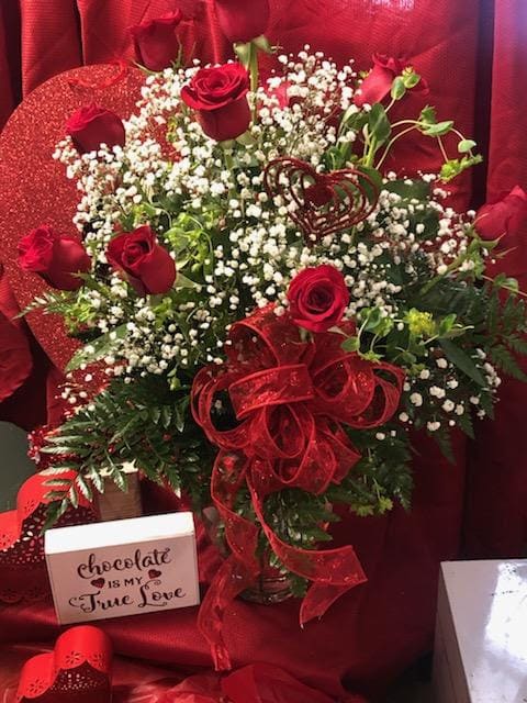 Highest quality premium Red Roses arranged in a beautiful vase with all