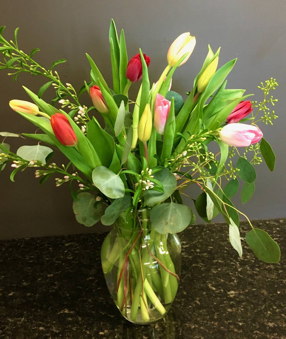 10 mixed tulips with nice greenery and filler flower
