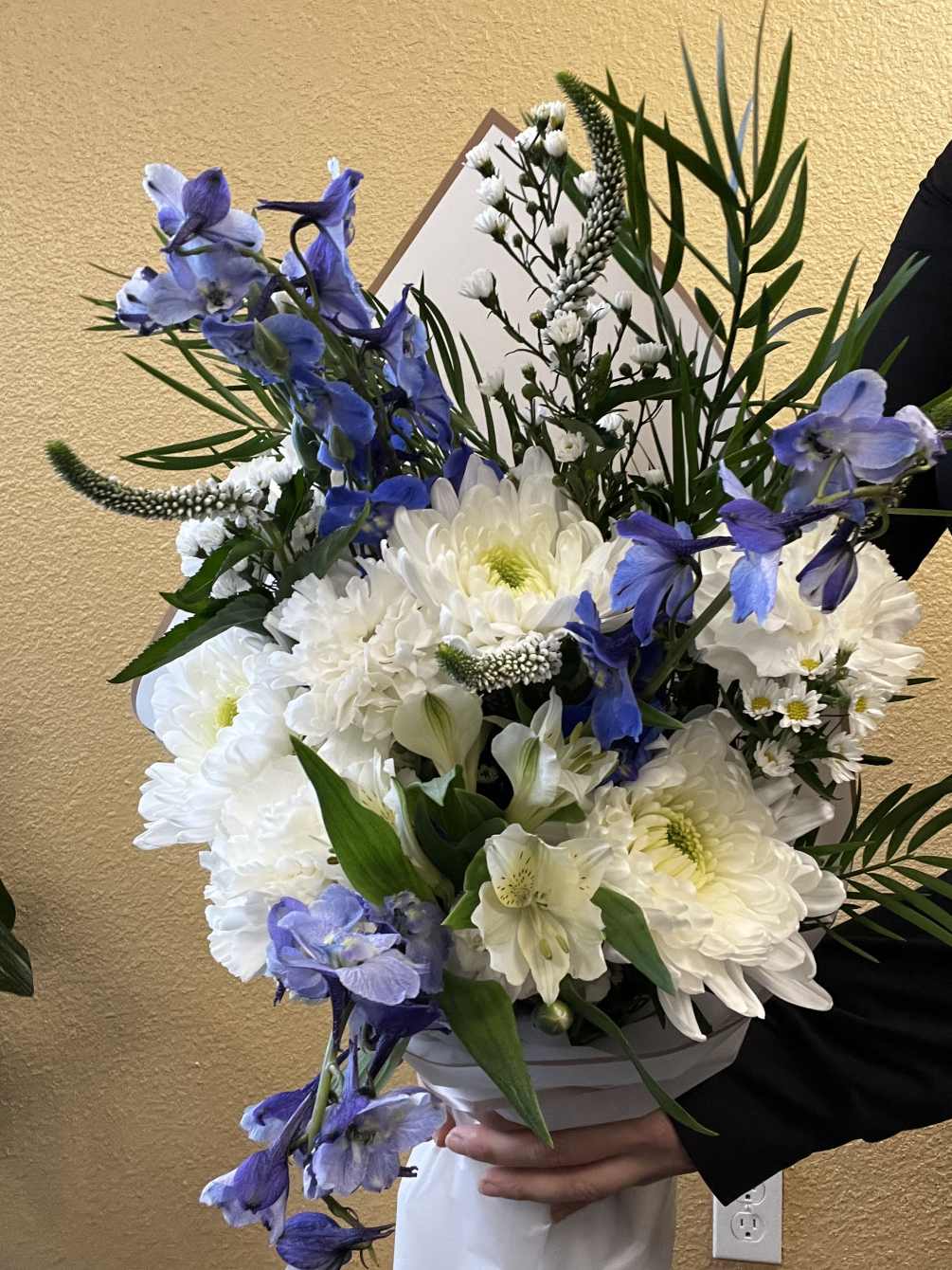 Blue and white and everything nice, this wrapped bouquet is perfect for