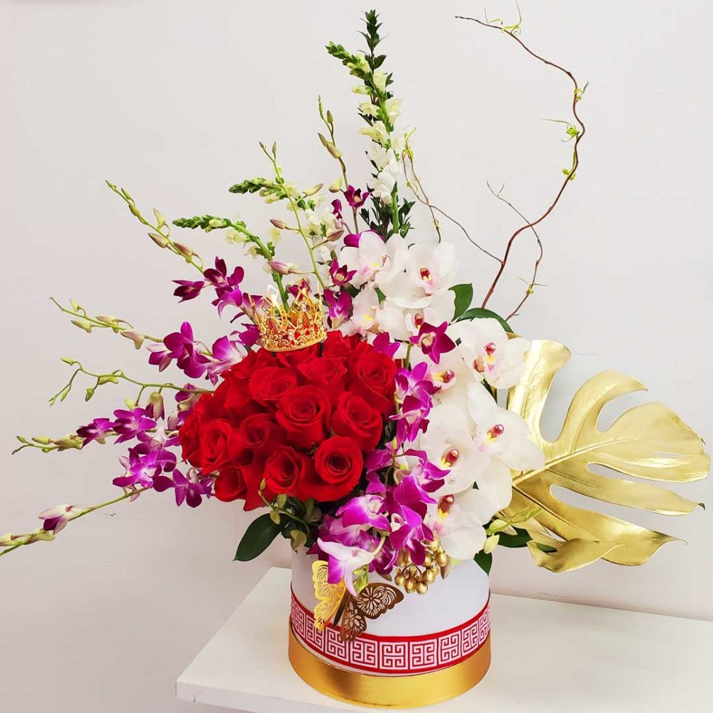 Luxurious Flower Arrangement, designed with a bouquet of Red Roses  decorated