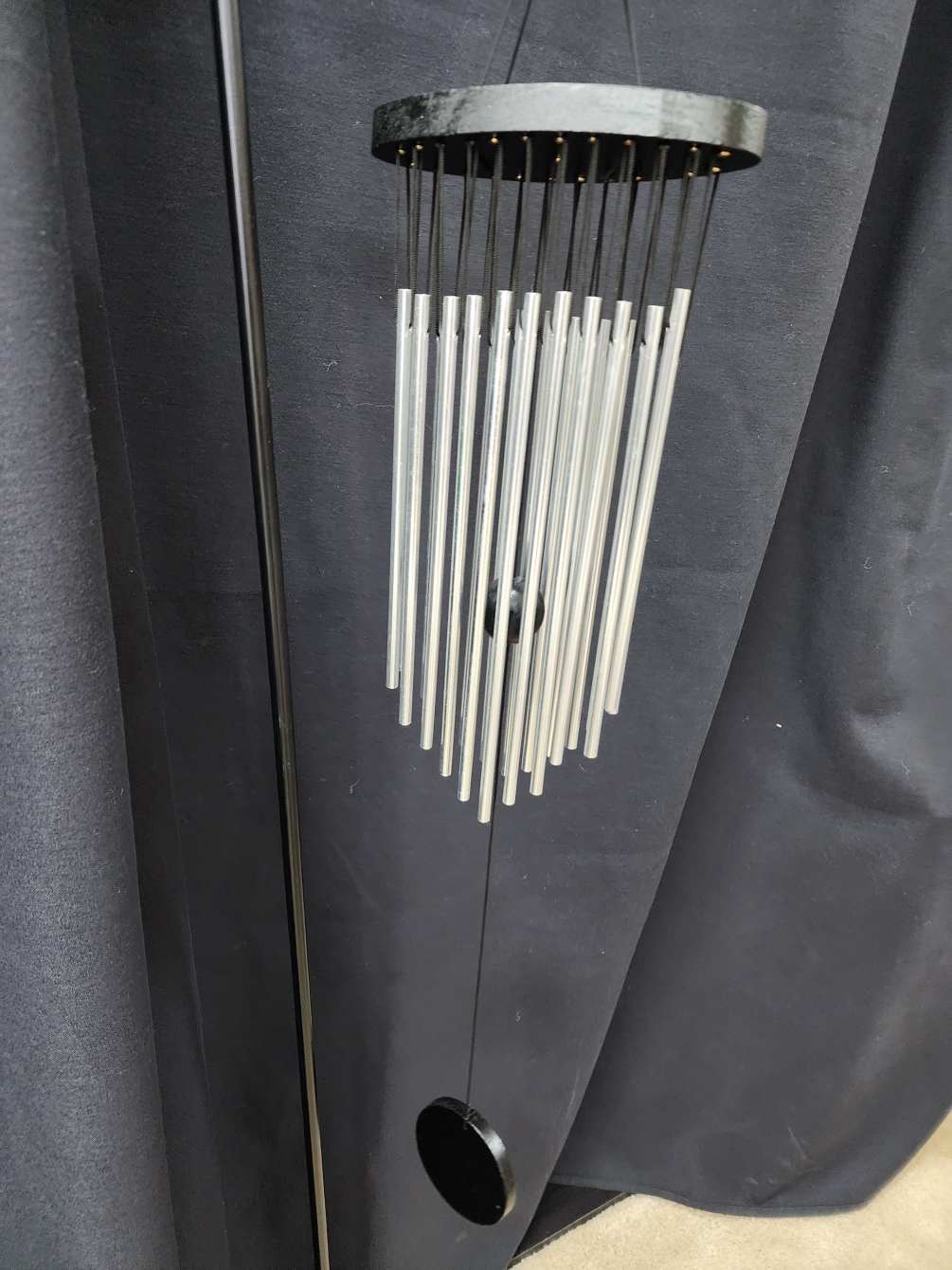 A beautiful set of black and silver wind chimes perfect for any