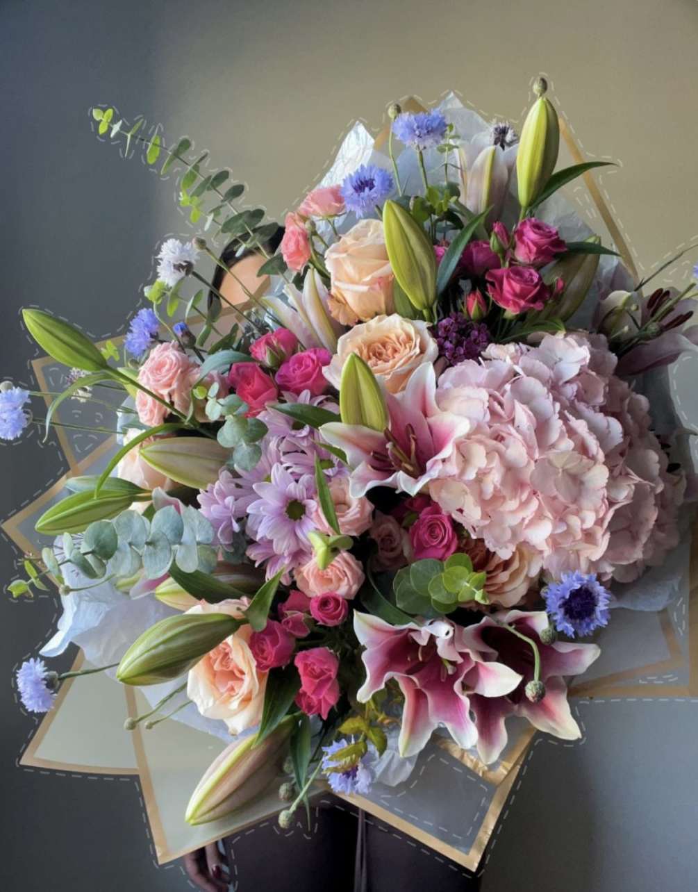 The impressive bouquet of mixed flowers is a stunning arrangement that combines