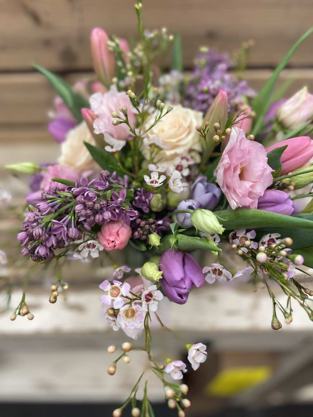 Low and lush arrangement featuring Spring&#039;s softer colors.  Designed in a