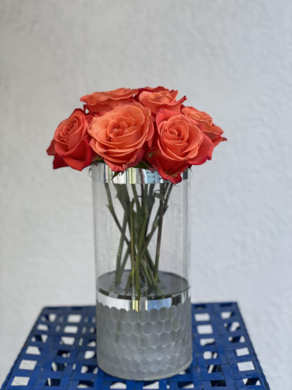 13 long stem Orange roses with an smooth, elegant tangerine center arranged