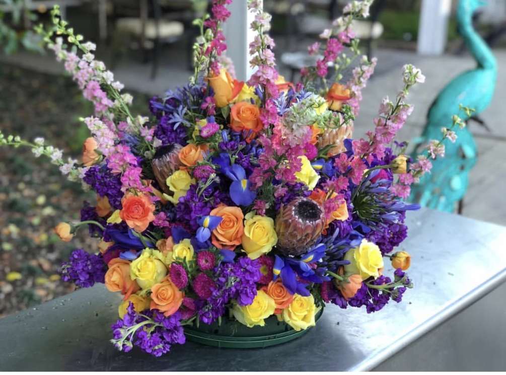 This vivid and eye-catching arrangement is built to be the center of