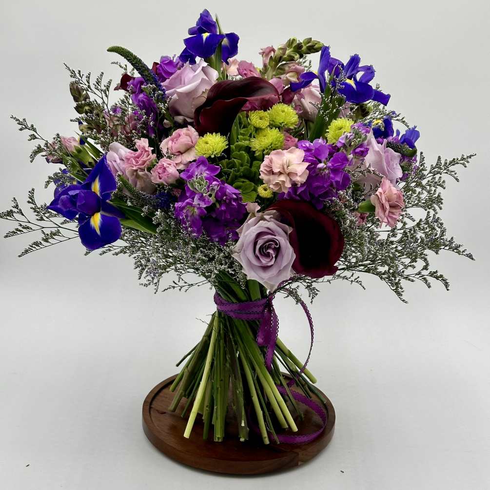 A beautiful purple and lavender French-style bouquet would likely feature a stunning