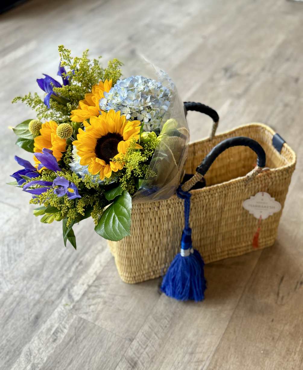 This vibrant bouquet features a stunning combo of blue hydrangea, cheerful sunflowers