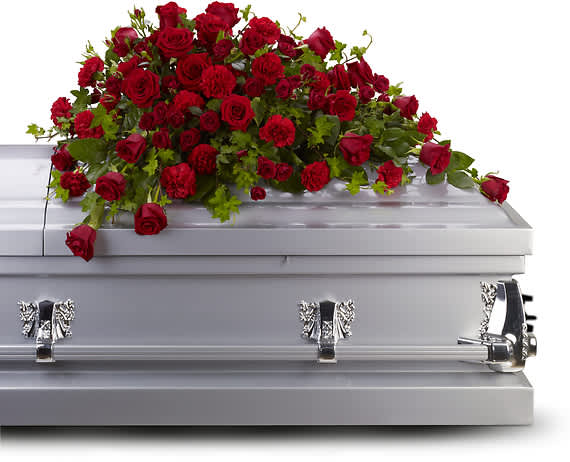 The deep red flowers of this red rose casket spray speak to