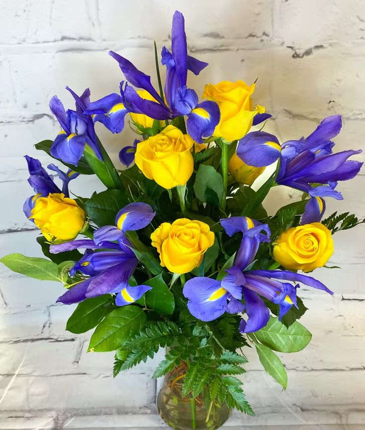 This bright blue and yellow arrangement is sure to brighten up someone&#039;s