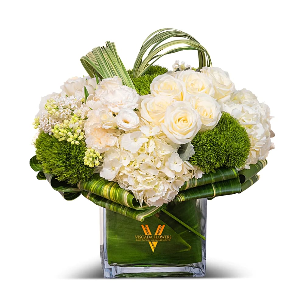 This elegant bouquet features white hydrangeas, white roses, and greens, creating a
