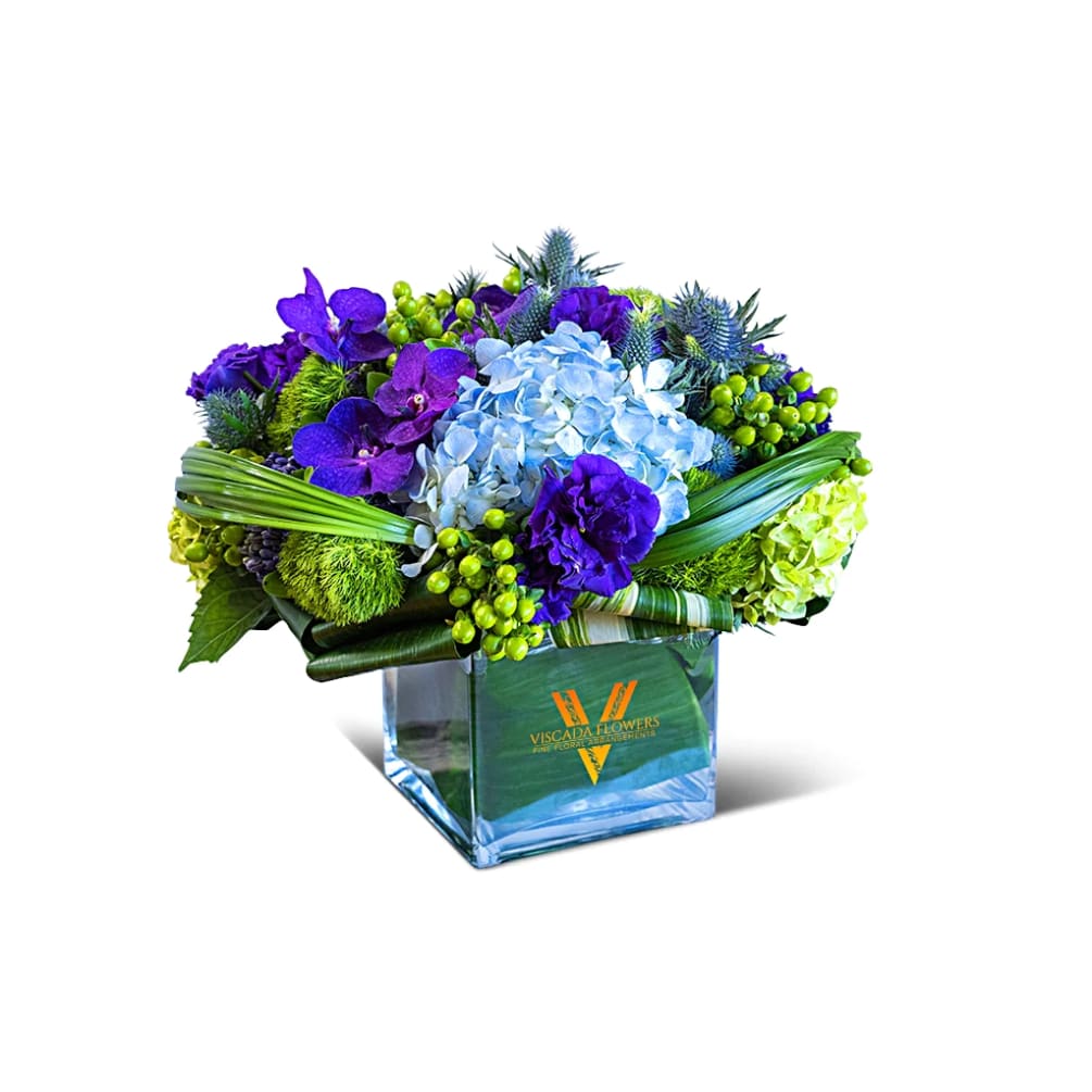 Refreshing and soothing, this bouquet combines blue hydrangeas, green dianthus, purple muscari